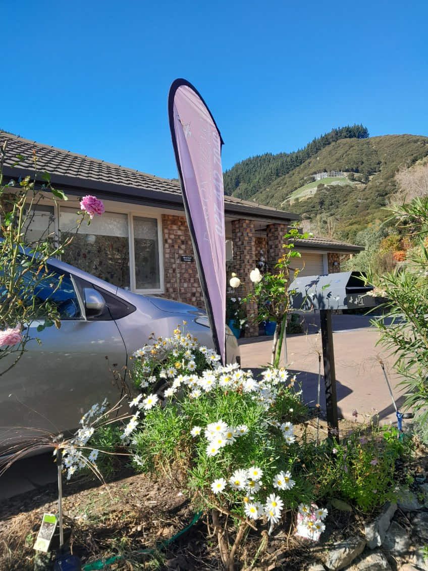 Ears On The Move flag outside the house at 21 Springlea Heights, Atawhai, with off-street parking
